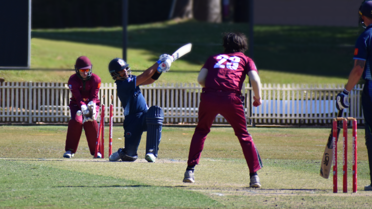 Matt Wright bowls Ollie Davies